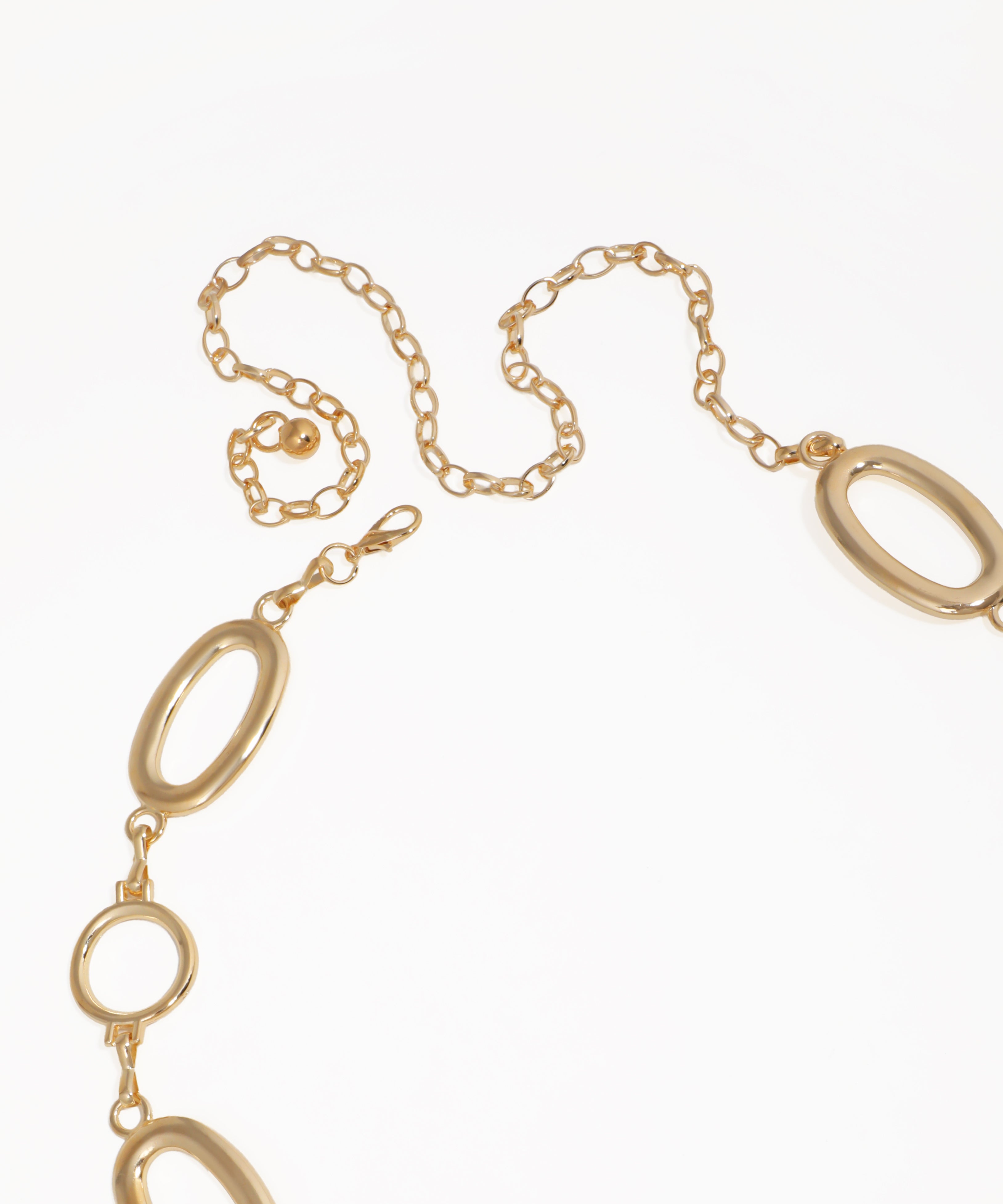 Gold chain necklace on a white background
