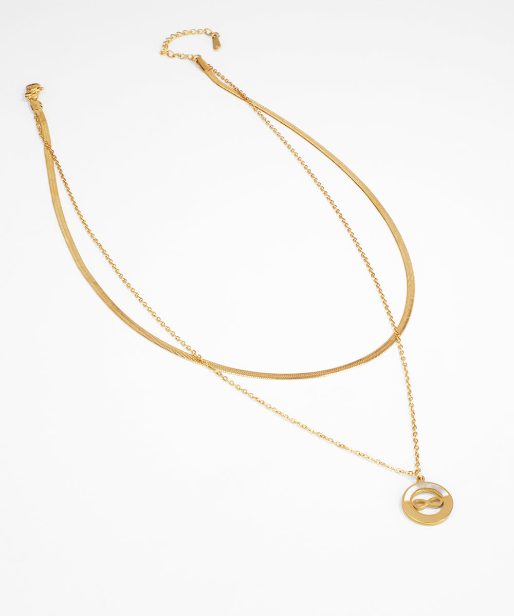 Gold necklace with a pendant on a white background