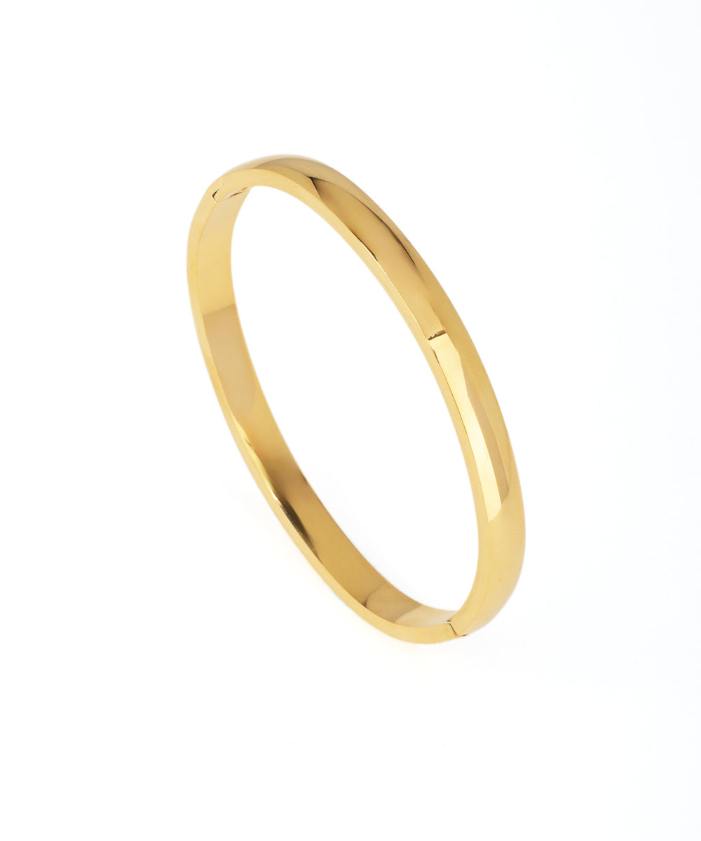 Gold bracelet on a white background