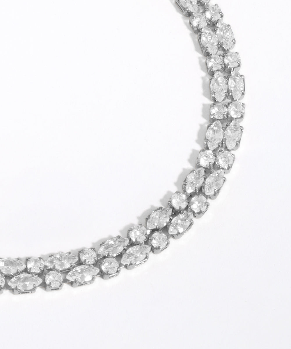 Diamond necklace on a light gray background