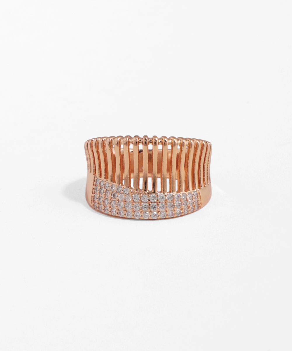 Rose gold bracelet with clear stones on a white background