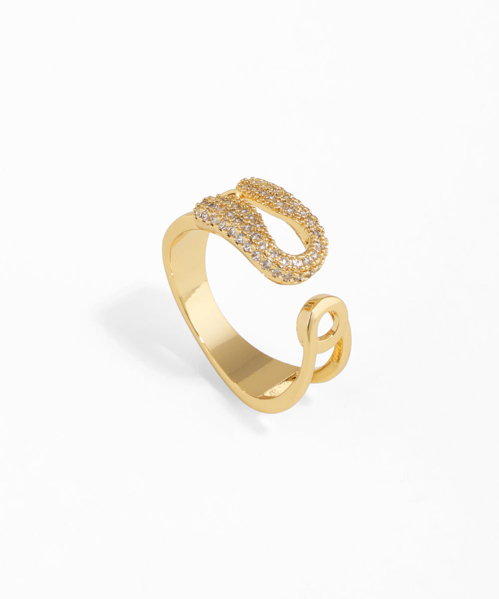 Gold-tone open band ring with an S-shaped pave design and a smooth looped end