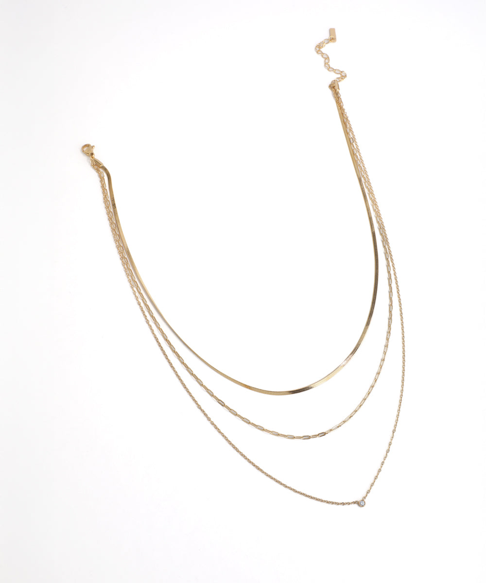 Gold necklace on a white background