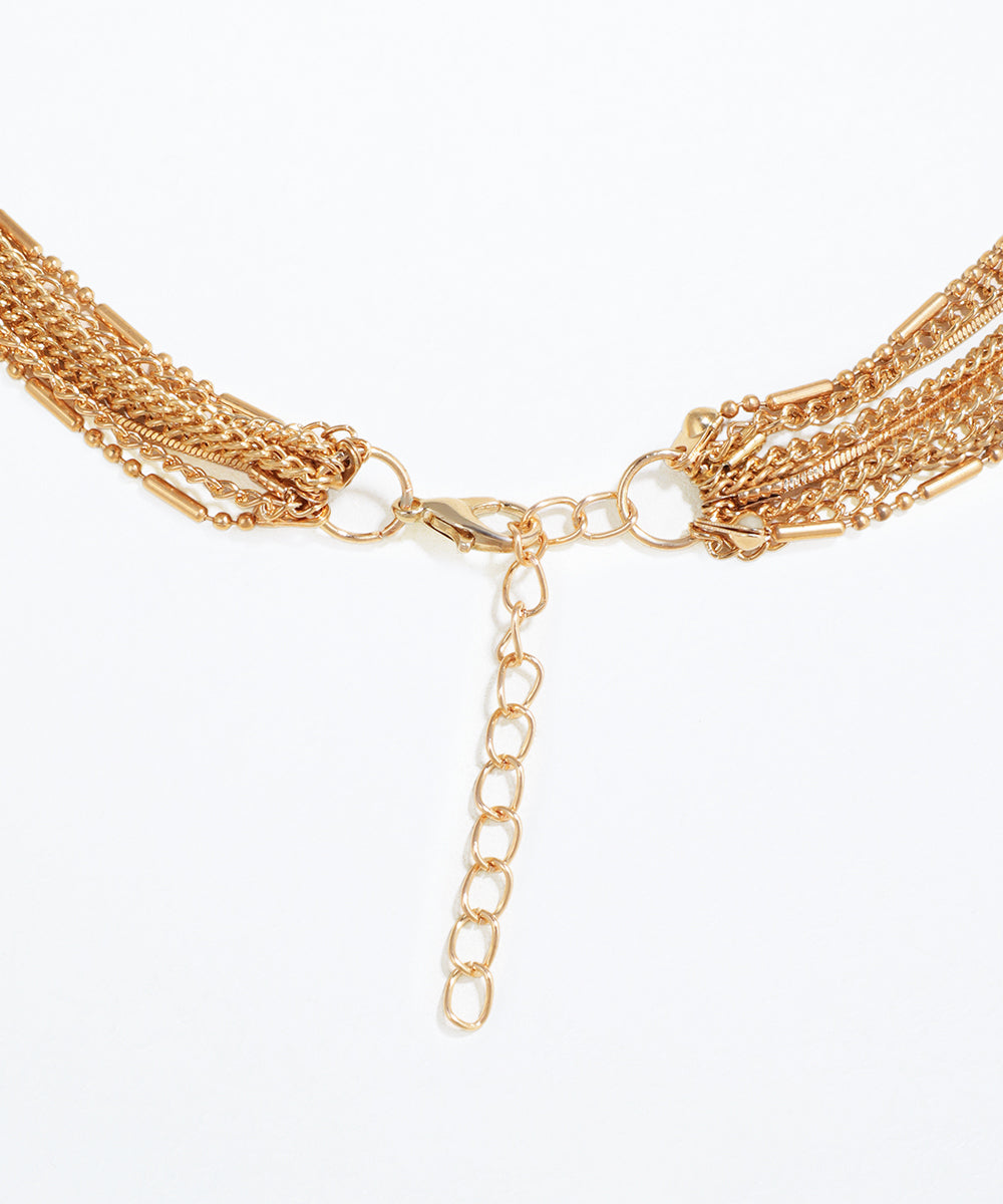 Gold chain necklace on a white background