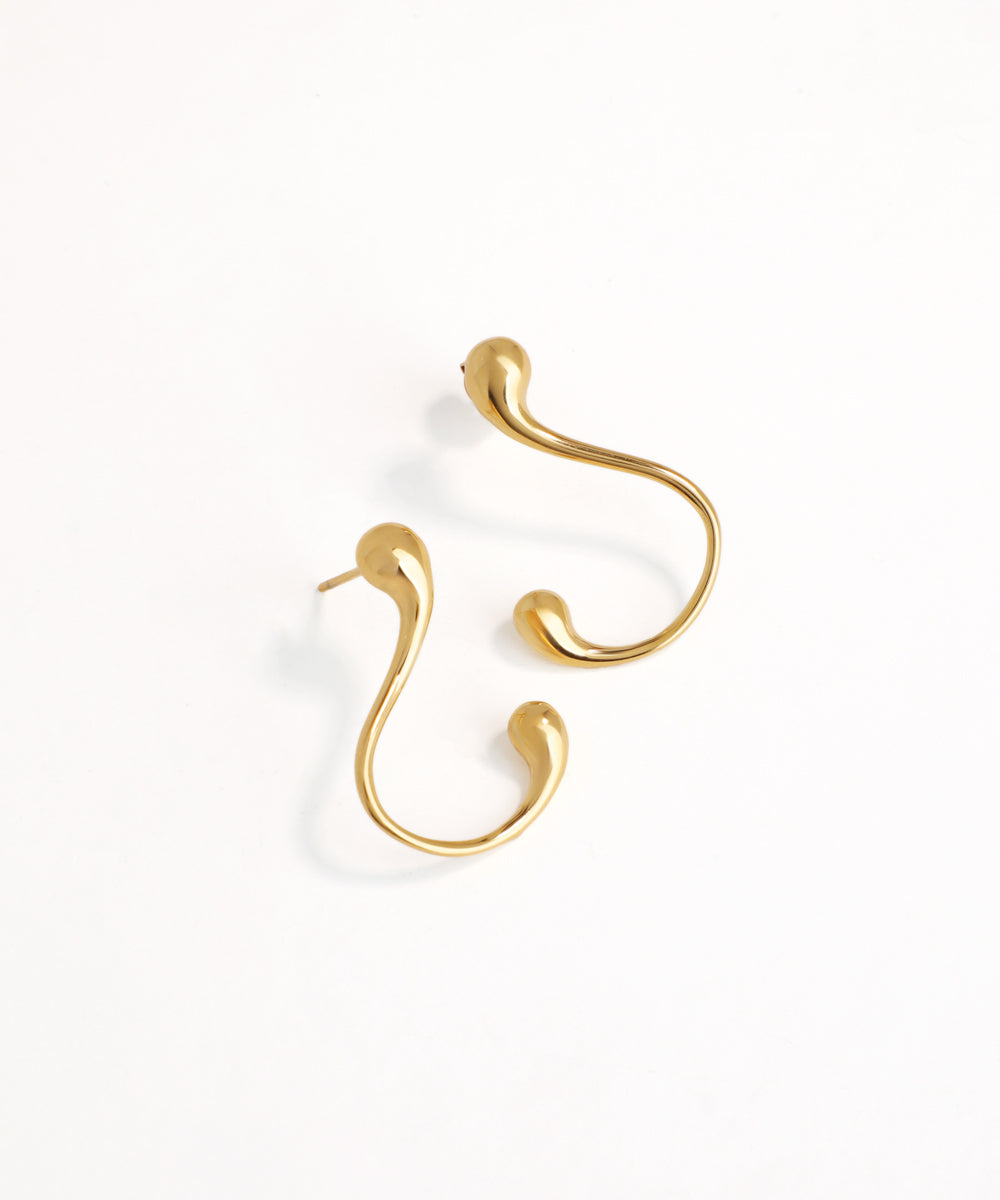 Gold elegant curve earrings on a white background