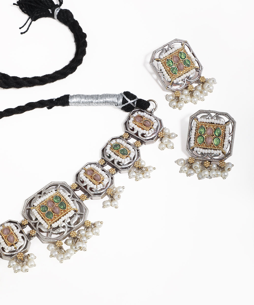 Jewelry set with necklace and earrings on a white background