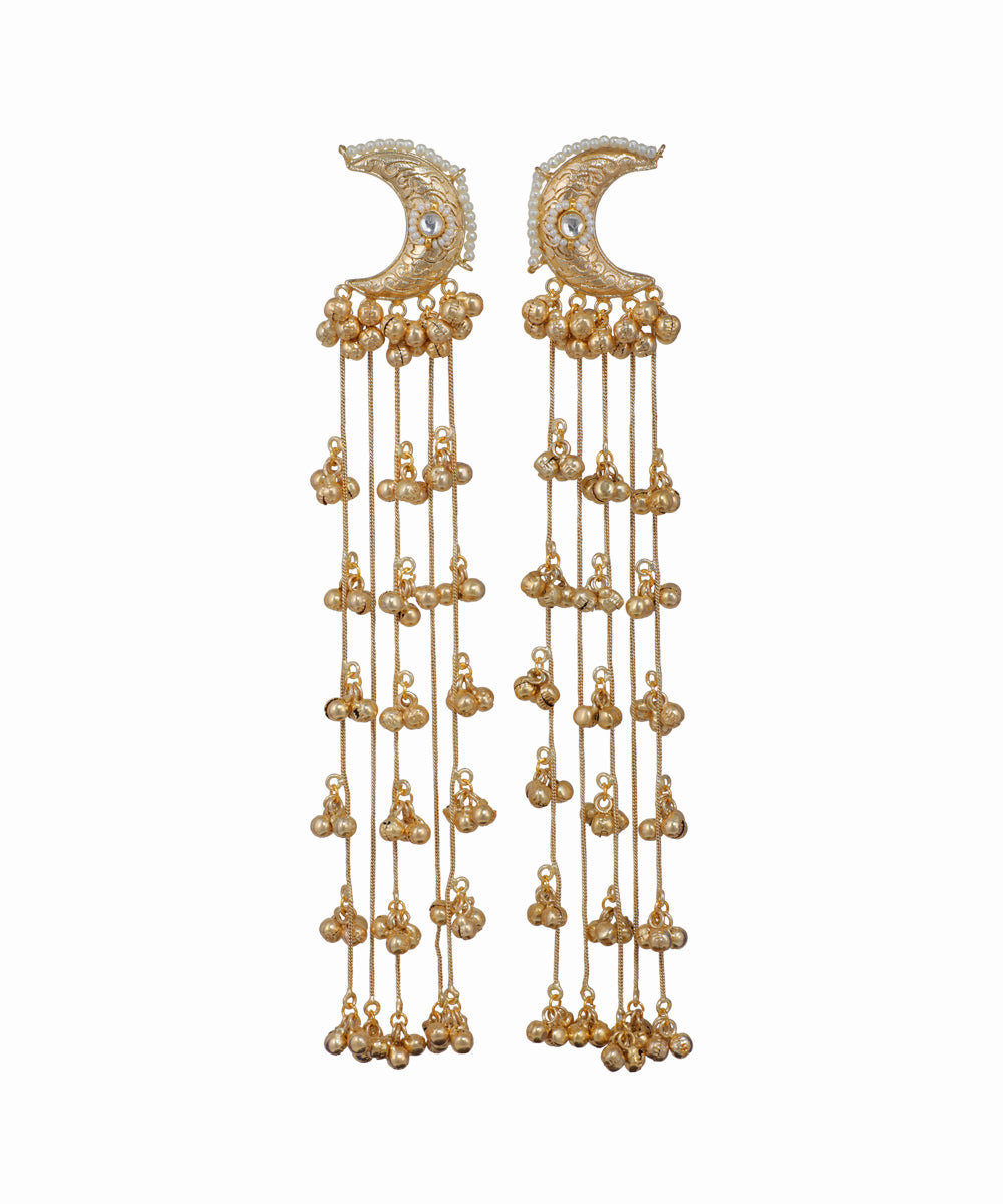 Pair of gold earrings with crescent moon designs on a white background