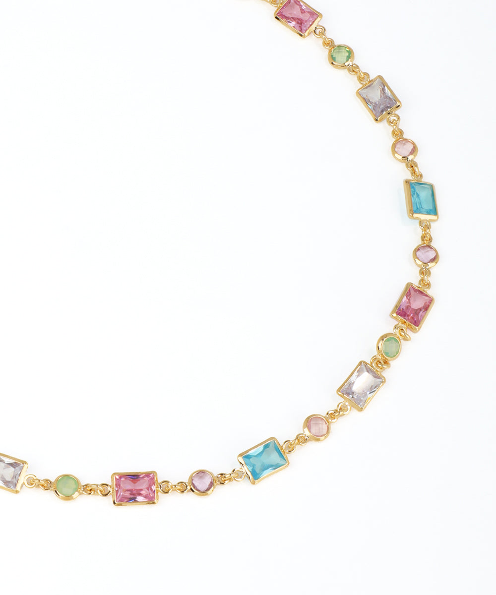 Necklace with multicolored gemstones on a white background