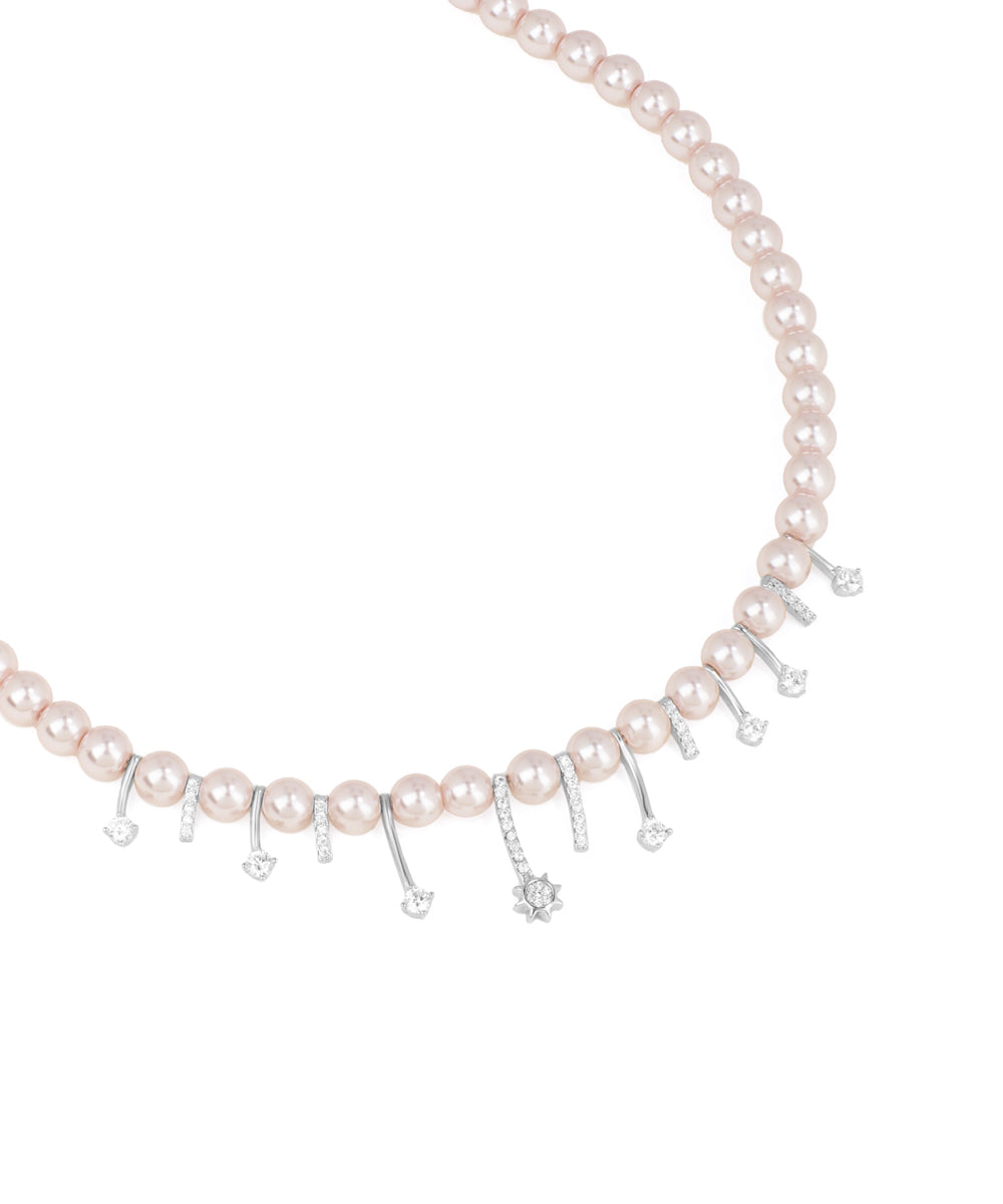 Pearl necklace with silver charms on a white background