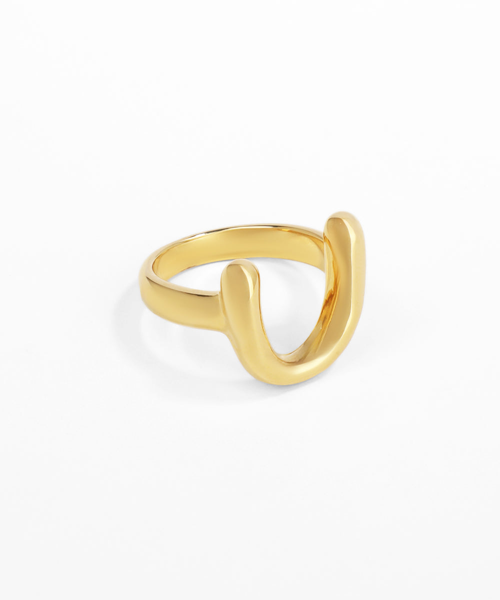 Gold ring on a white background