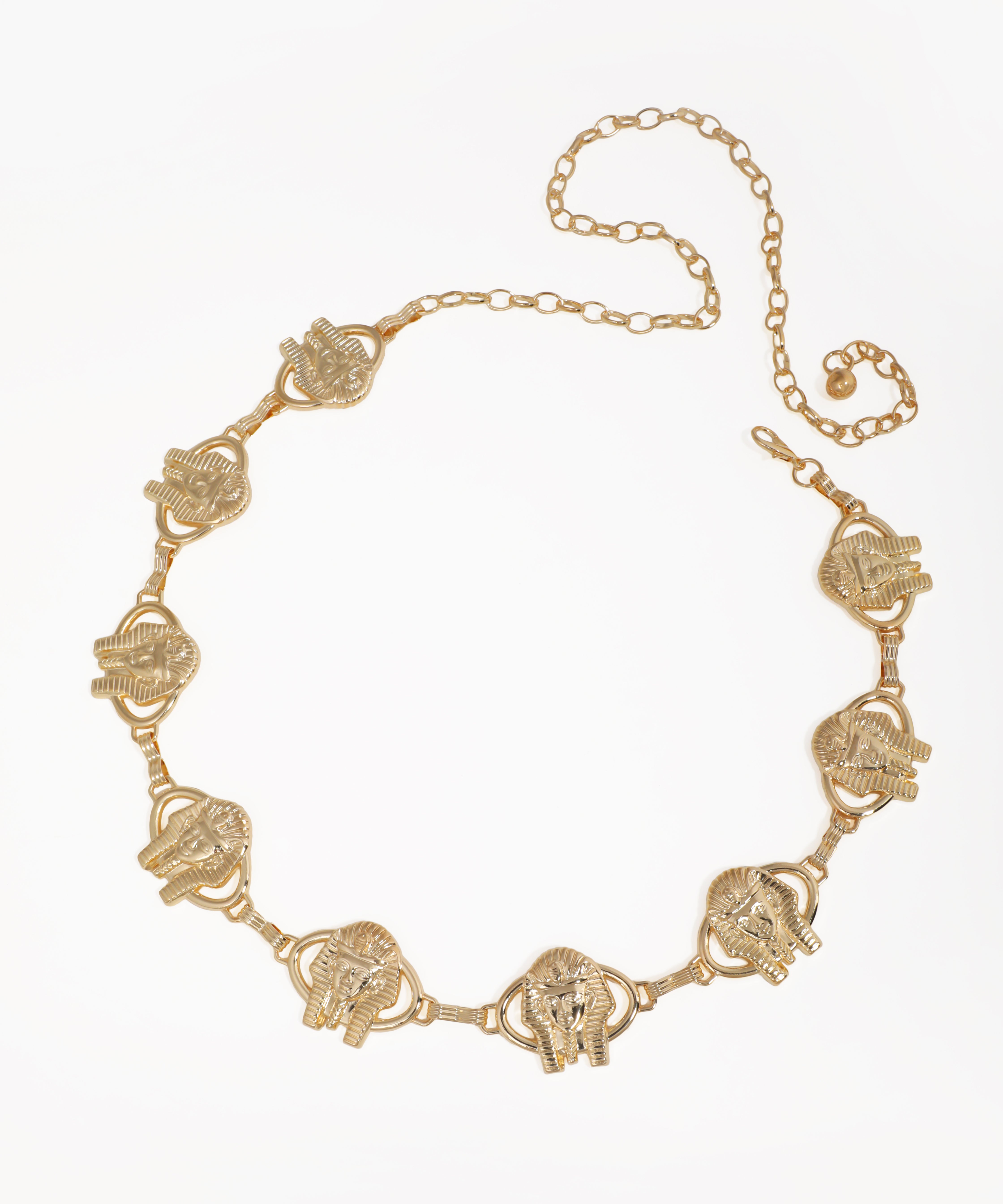 Gold-tone waist chains with repeating embossed Pharoah head charms and an adjustable chain closure