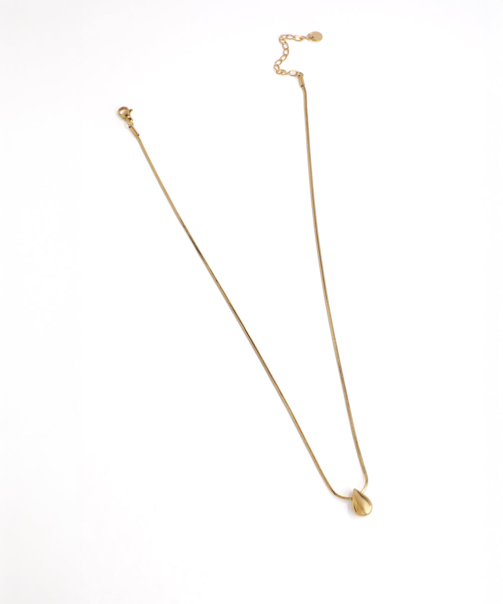 Gold necklace on a white background
