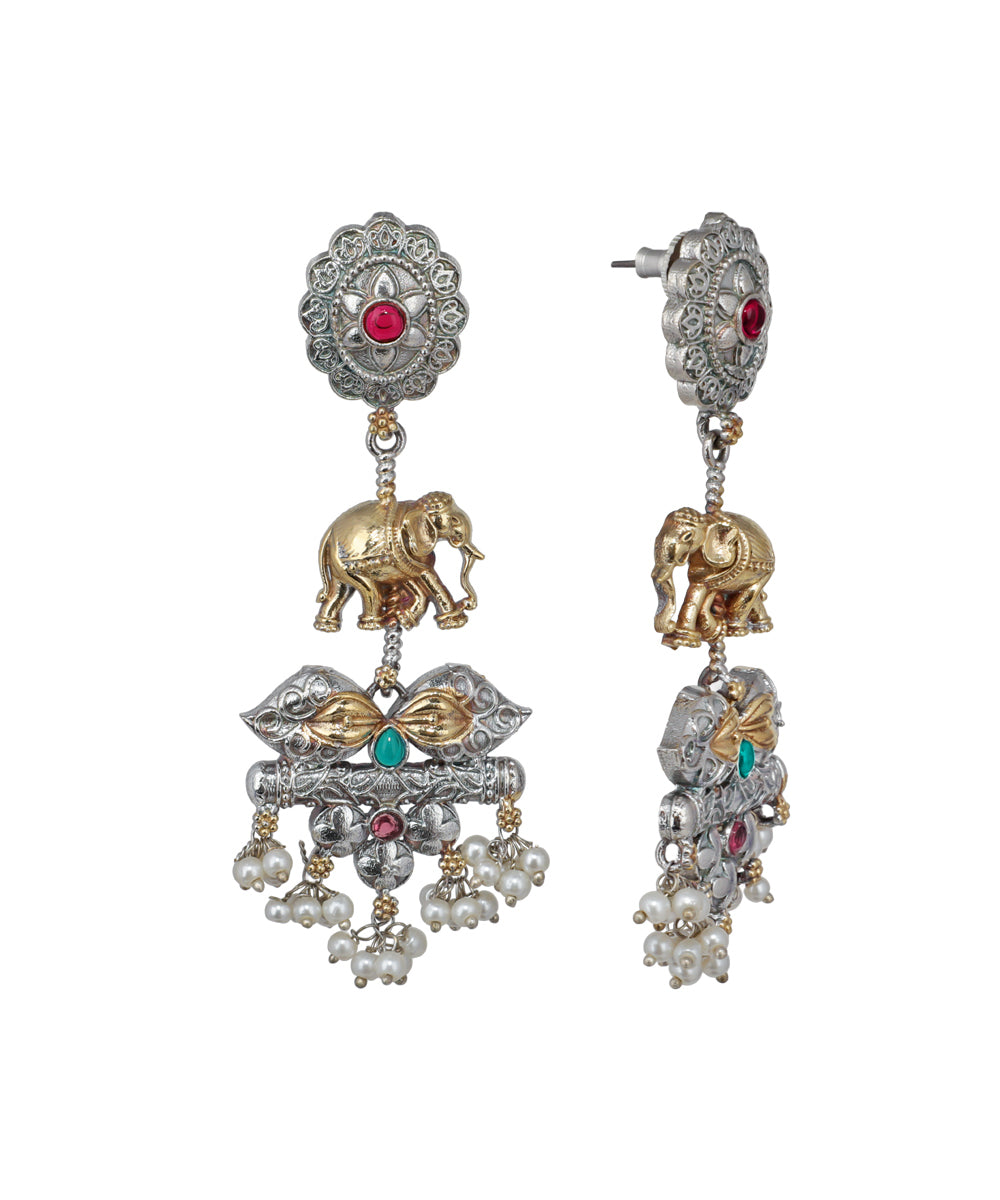 Ornate earrings with elephants and gemstones on a white background
