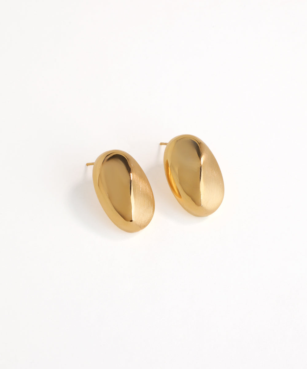 Gold hoop earrings on a white background