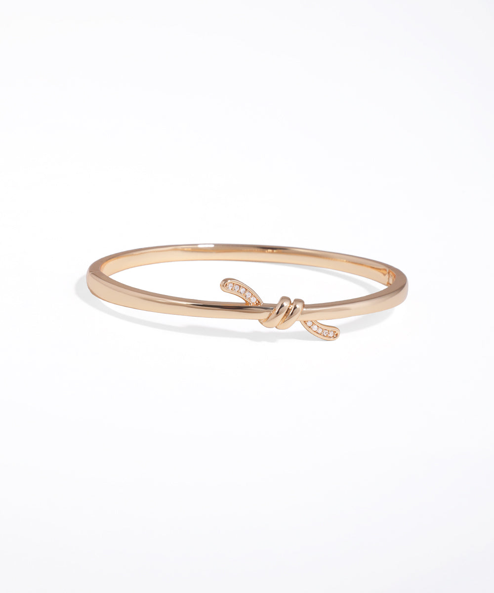 Rose gold bracelet on a white background