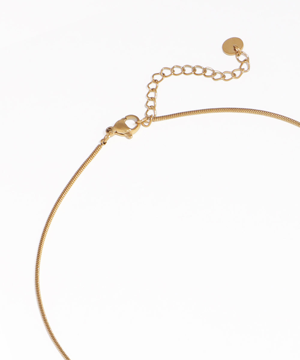 Gold necklace on a white background