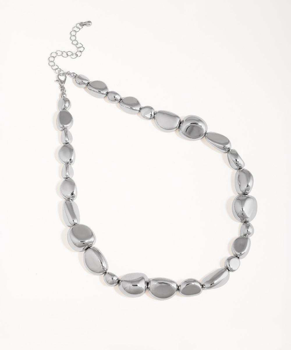 Rhodium finish necklace with polished irregular shaped links and an extender chain