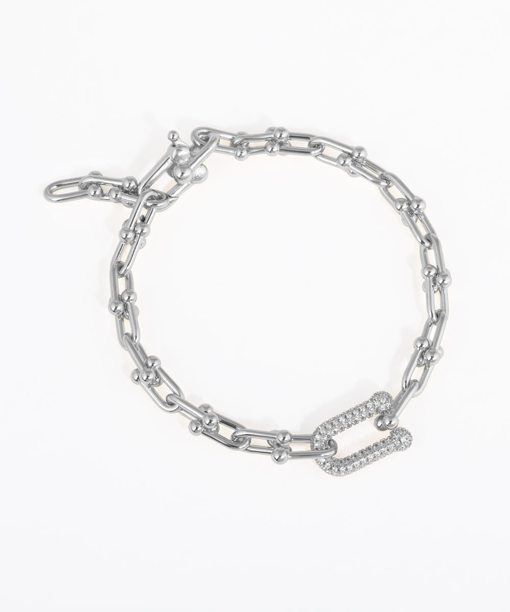 Silver chain bracelet on a white background