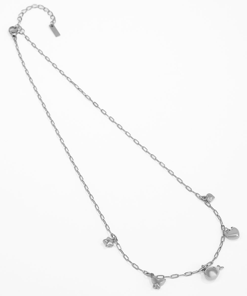 Silver necklace with heart-shaped pendants on a white background