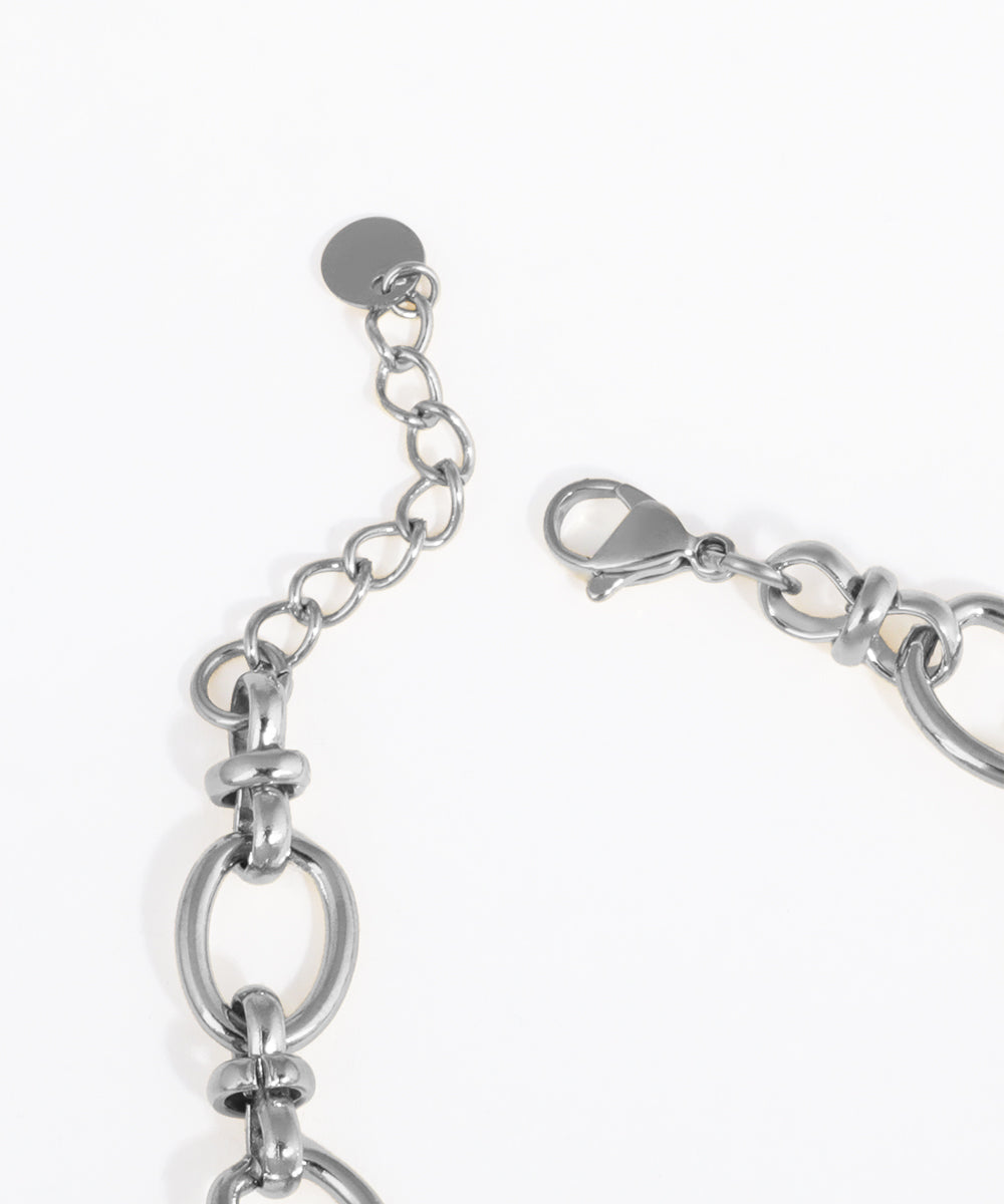 Close-up of a silver bracelet on a white background
