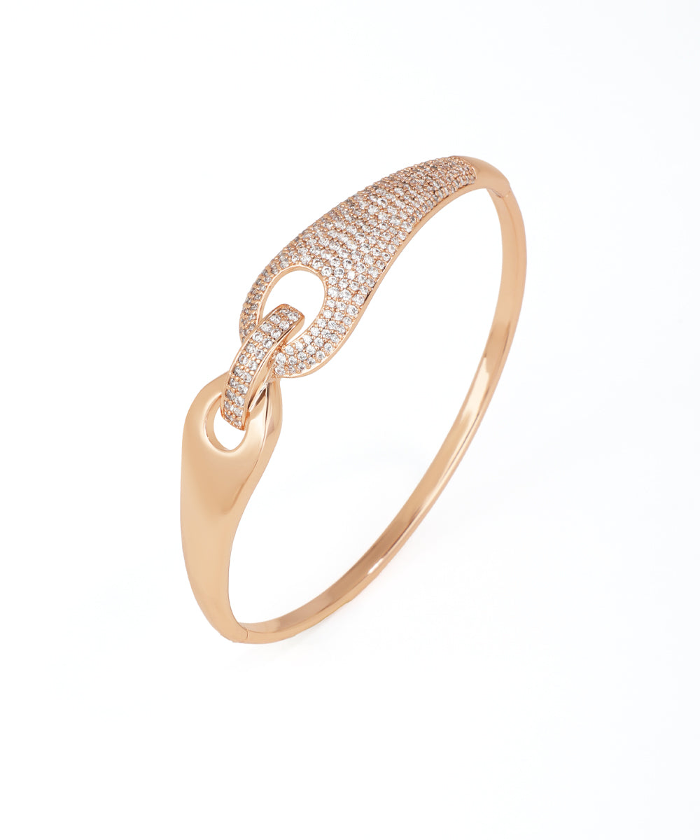 Rose gold bracelet with diamond accents on a white background