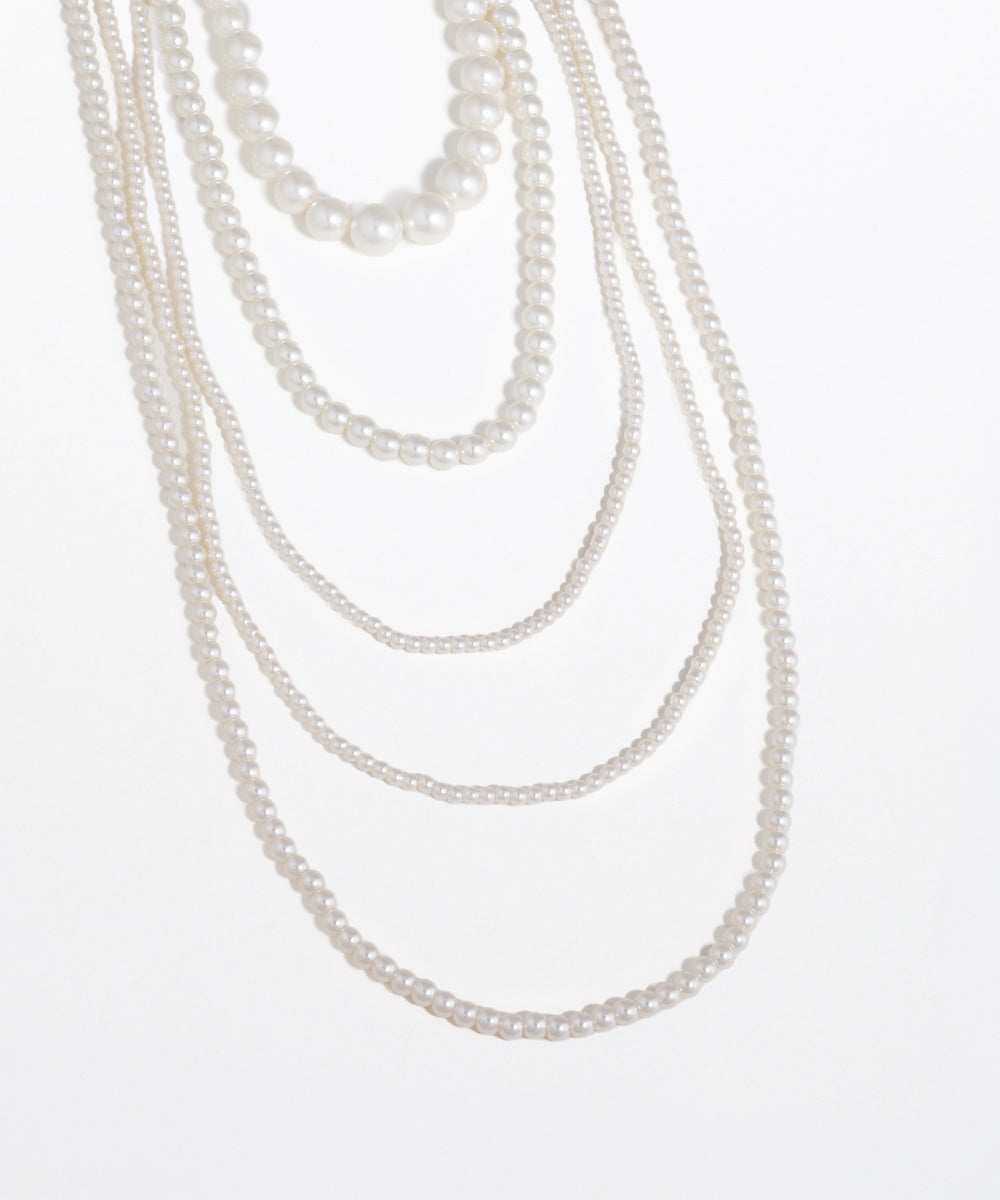 Set of pearl necklaces on a white background