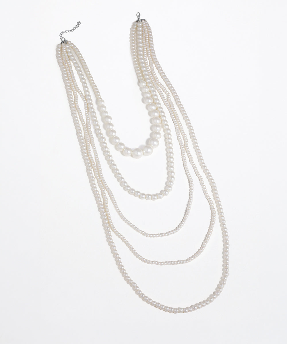 Rhodium finish multi-strand faux pearl necklace with varying pearl sizes