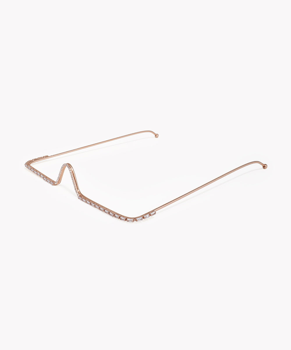 Rose gold cat-eye sunglasses frame on a white background