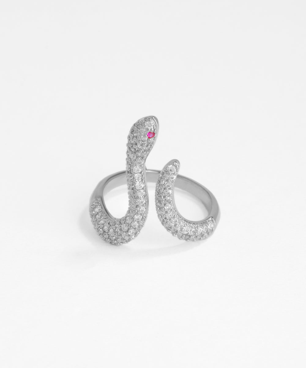 Silver snake-shaped ring with a pink gemstone on a white background