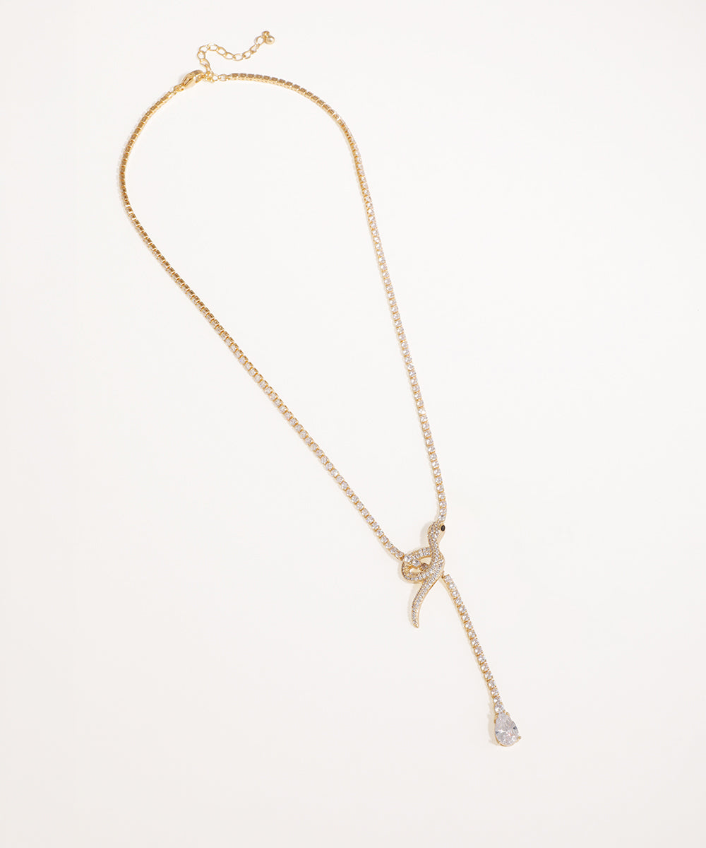 Gold-tone necklace with sparkling snake motif and pear-shaped Cubic Zirconia drop