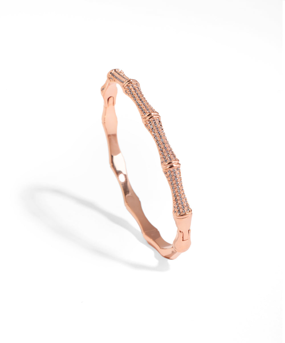 Rose gold bracelet on a white background