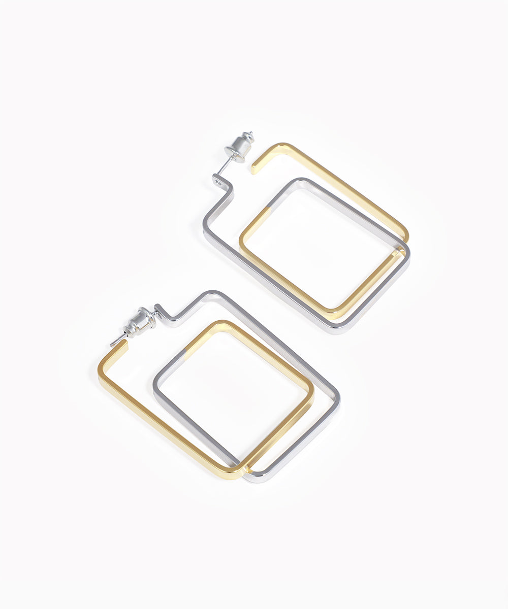 Pair of square hoop earrings in gold and silver on a white background