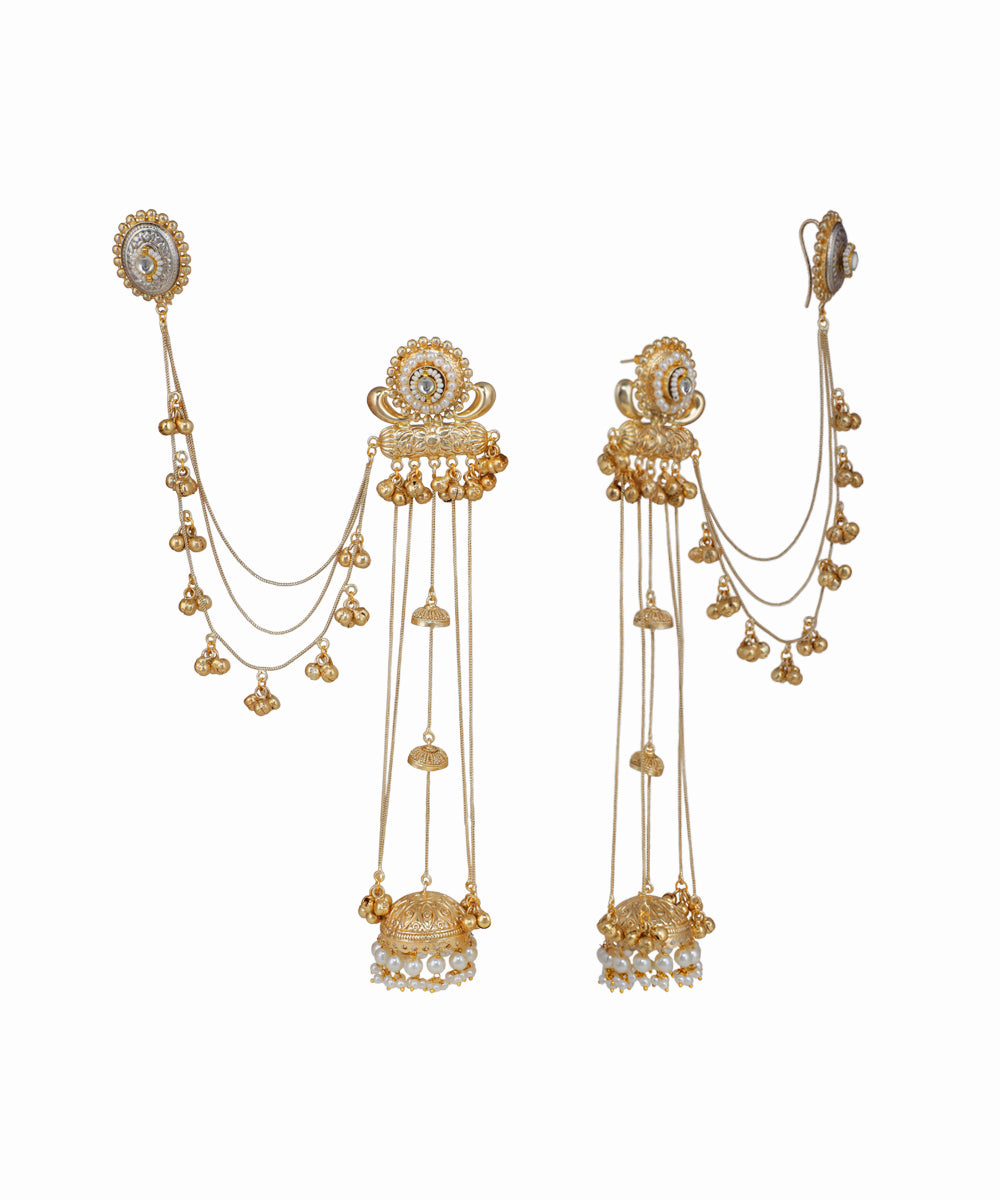Gold earrings with intricate designs on a white background