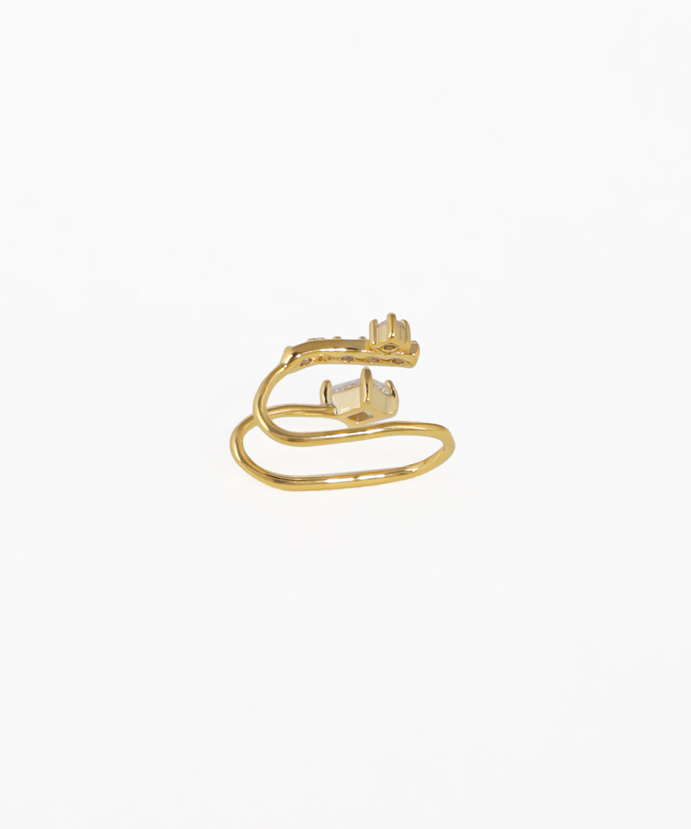 Gold ring with a diamond on a white background