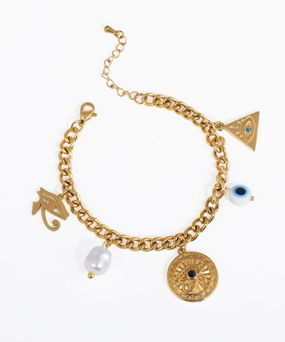 Gold-tone charm bracelet with symbolic eye charms and a faux pearl