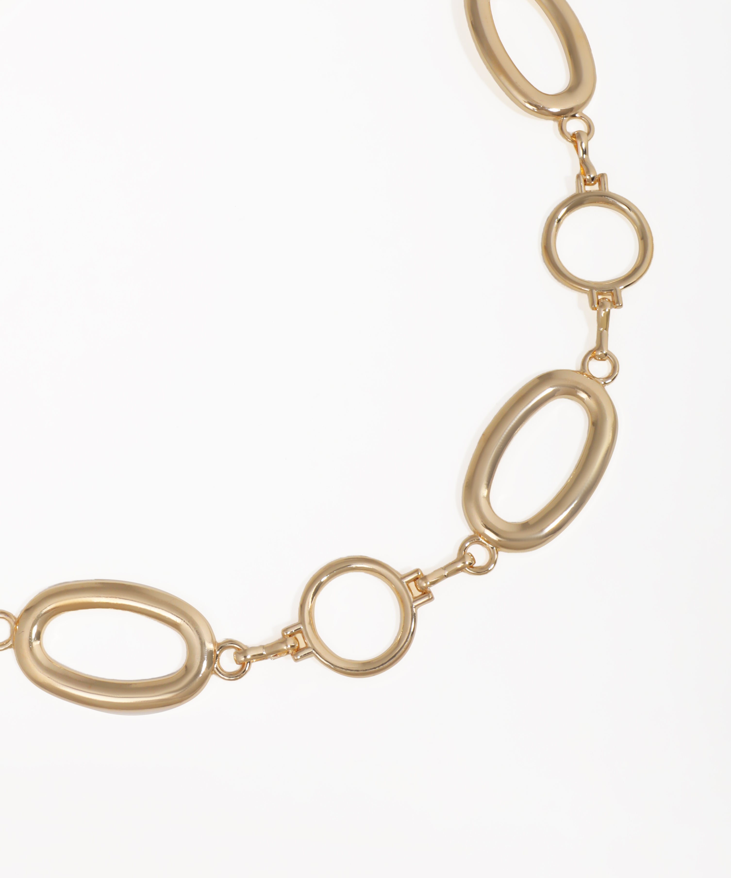 Gold chain necklace on a white background
