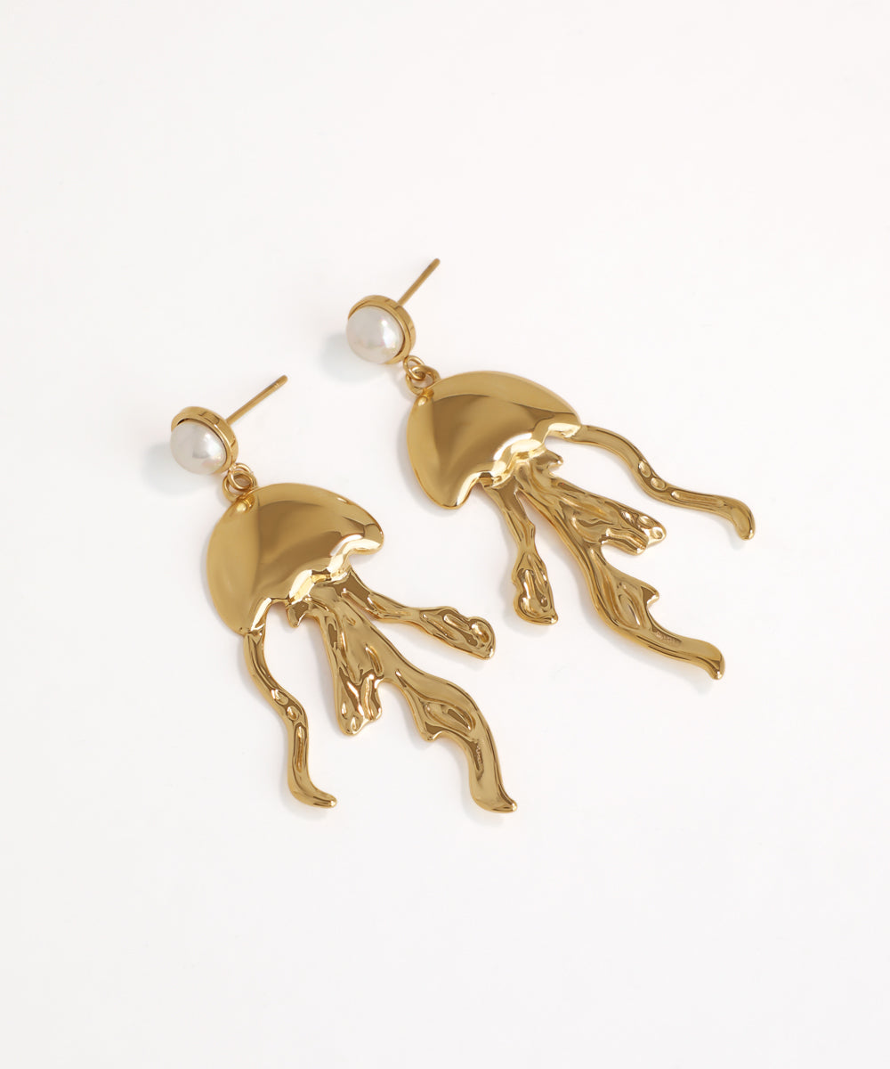 Gold jellyfish-shaped earrings on a white background