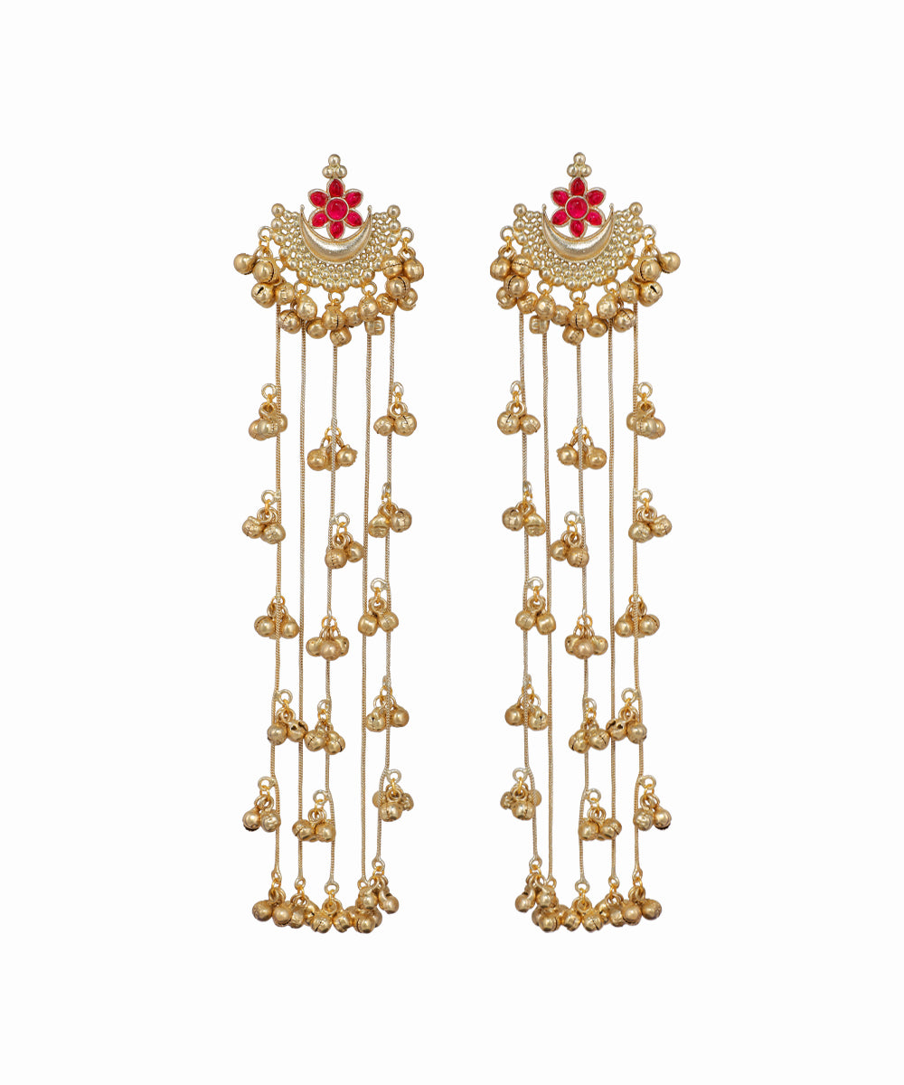 Pair of gold earrings with red floral elements on a white background