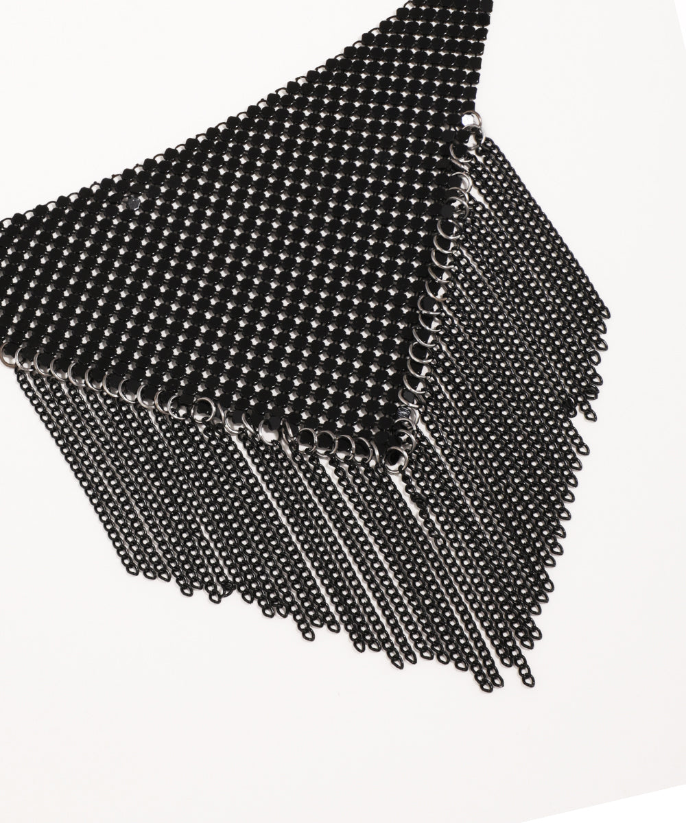 Black magnetic cube made of small balls on a white background