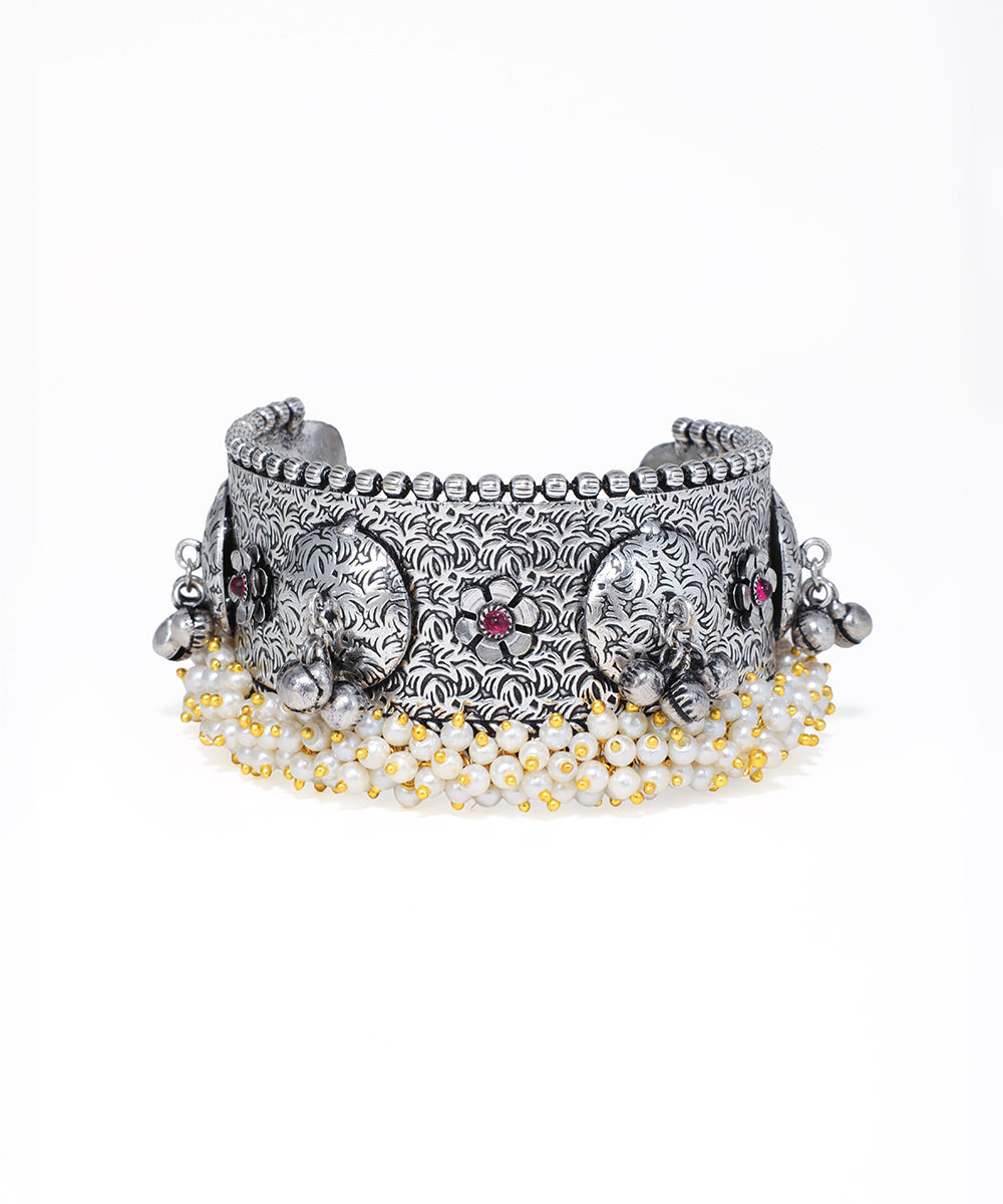 Silver elephant bracelet with beads on a white background