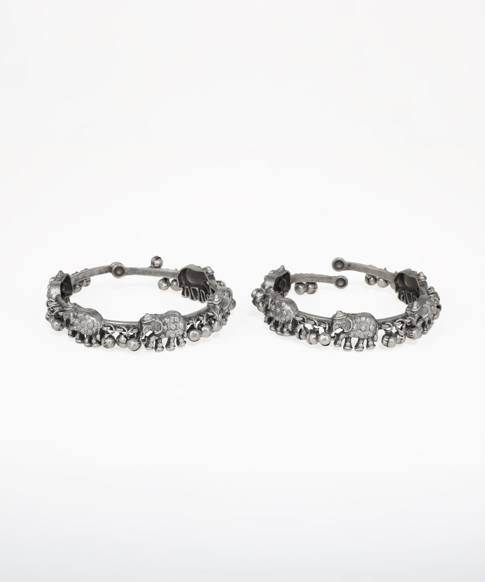 Oxidised silver-tone bangle bracelet with elephant motifs and small clear stones