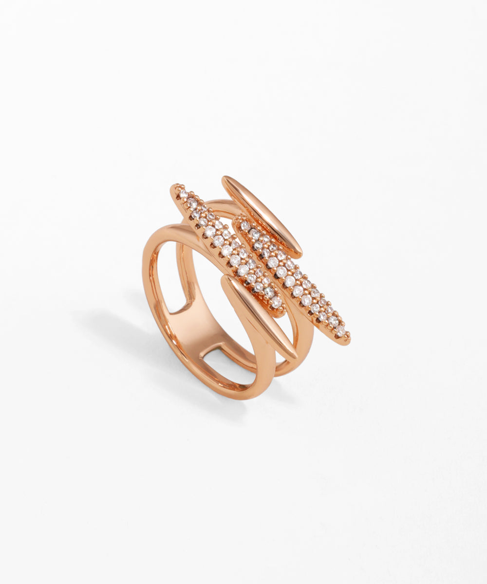 Rose-gold-tone ring with three intersecting bars, two set with sparkling clear stones.