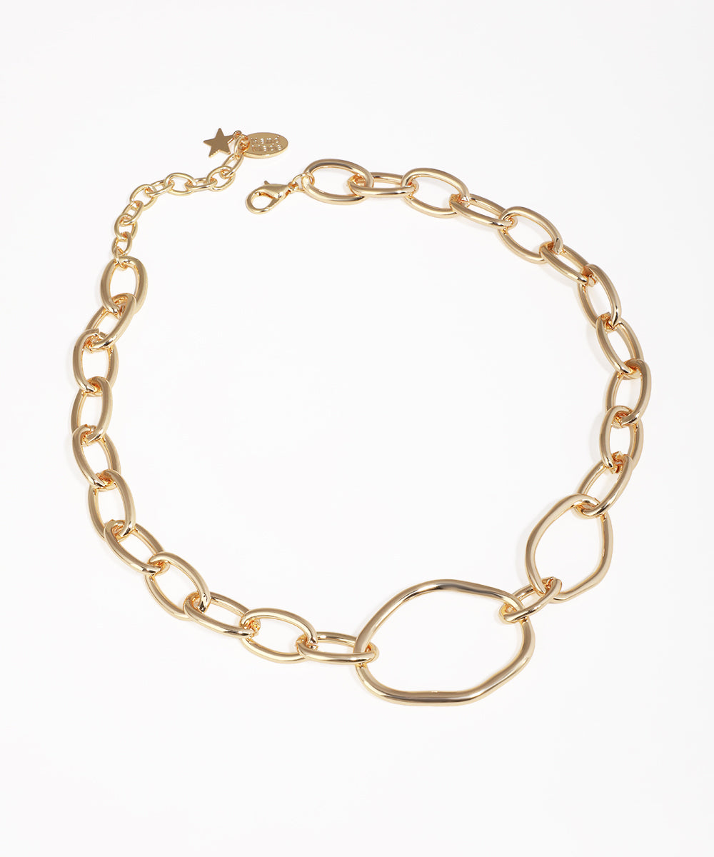 Gold-tone necklace with chunky chain links and an irregular central design