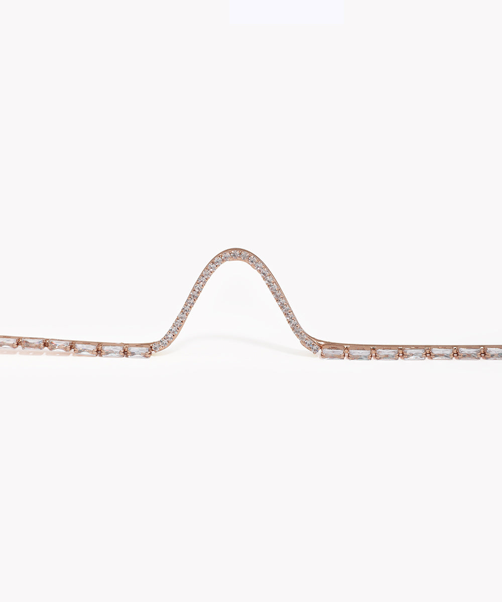Rose gold bracelet with diamonds on a white background
