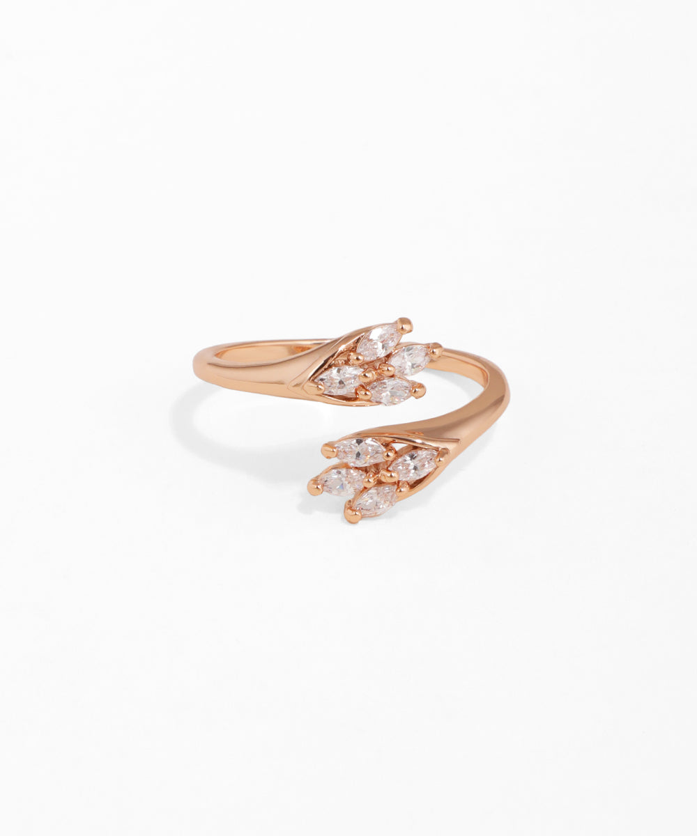 Rose gold open ring with clear gemstones on a white background