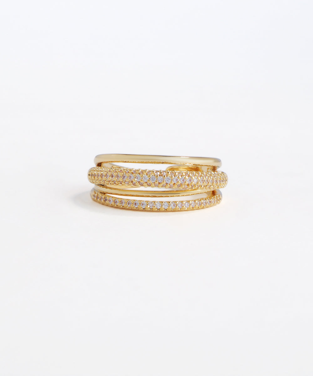 Set of gold rings with embedded diamonds on a white background