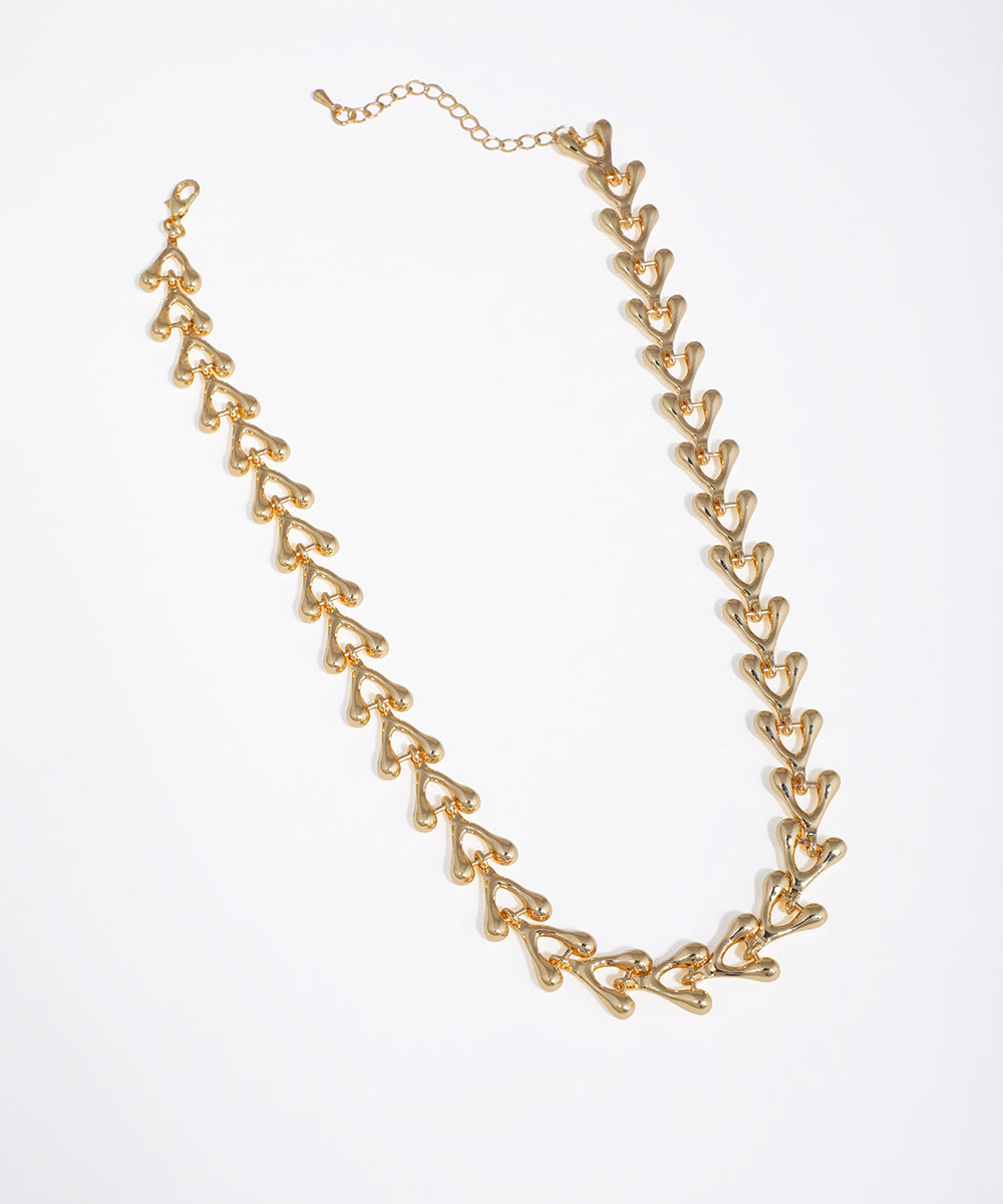 Gold-tone necklace with chunky, sculpted interlocking links and smooth polished finish