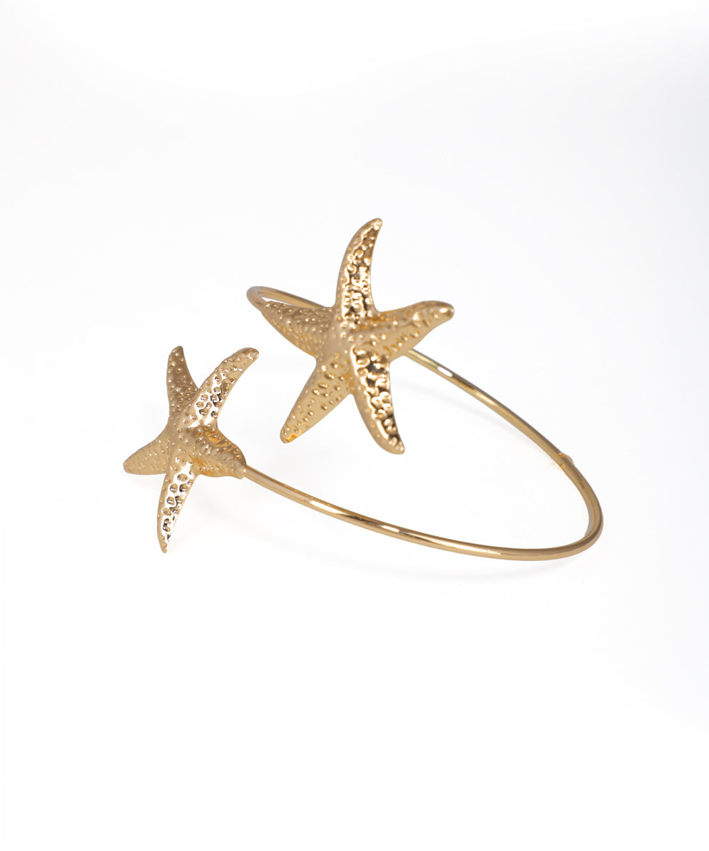Gold-tone arm cuff with two textured starfish motifs