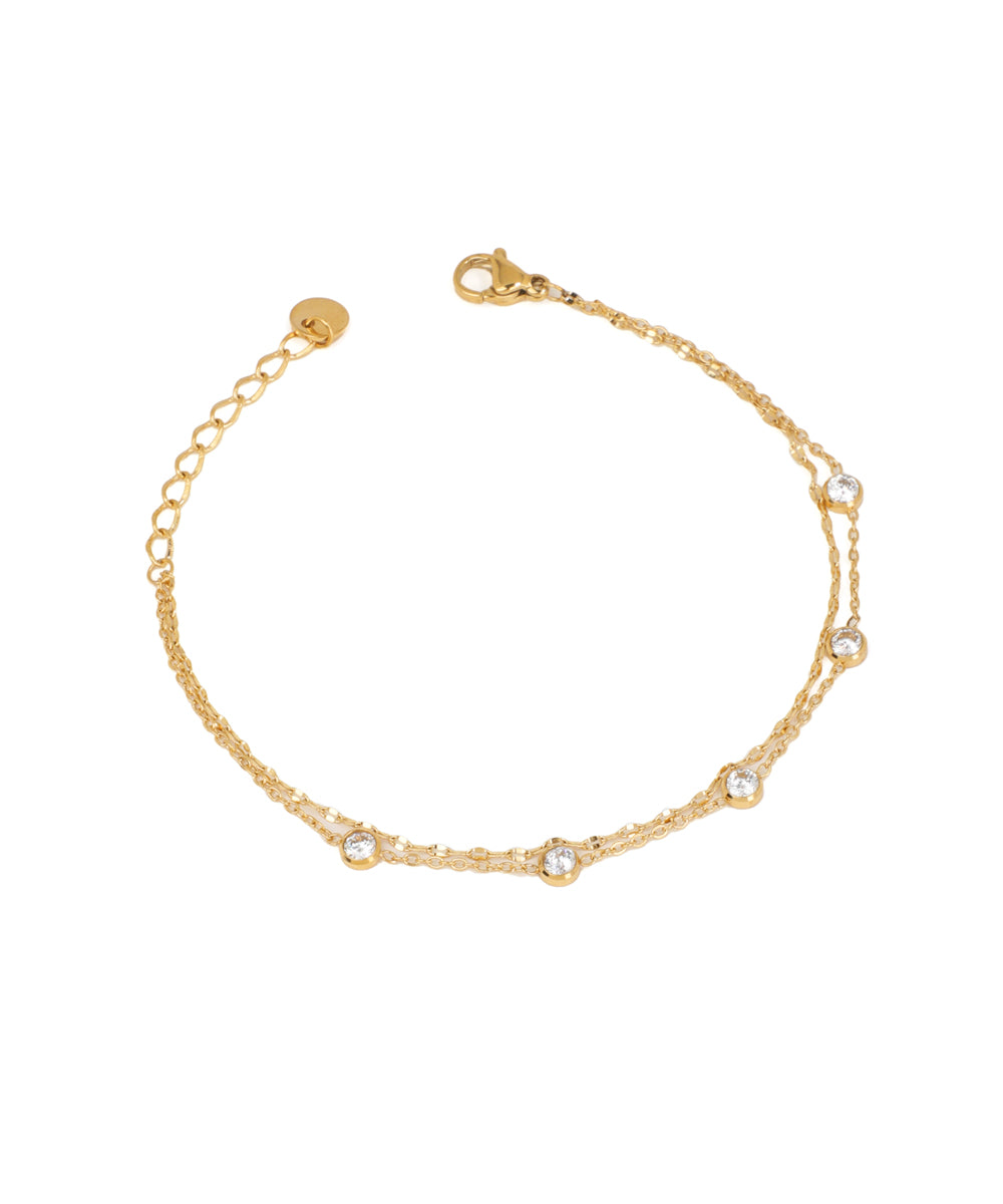 Gold-tone double chain bracelet with small round bezel-set CZ stones and lobster clasp closure