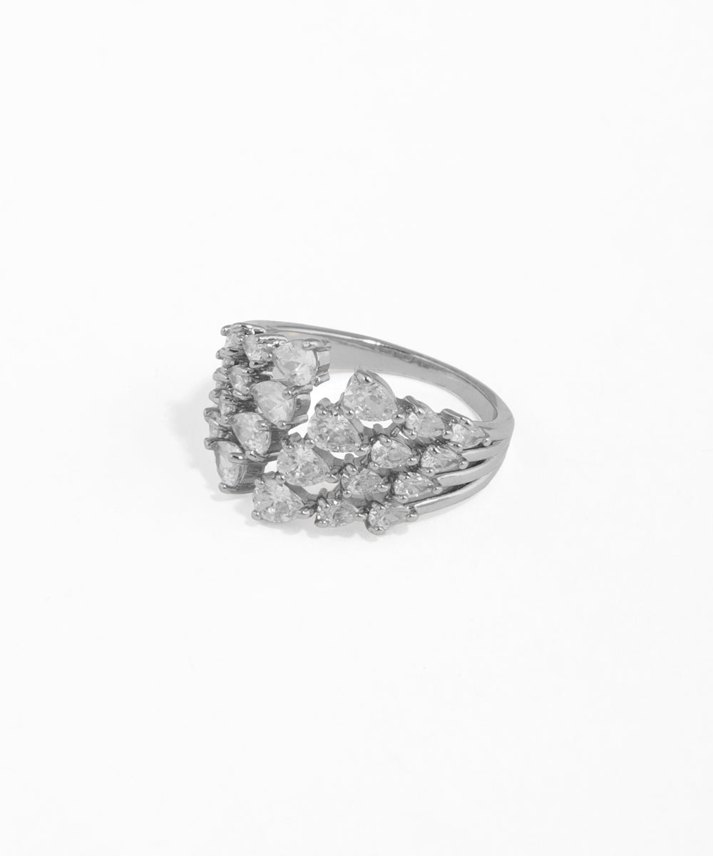 Small metallic object with two circular components on a gray background